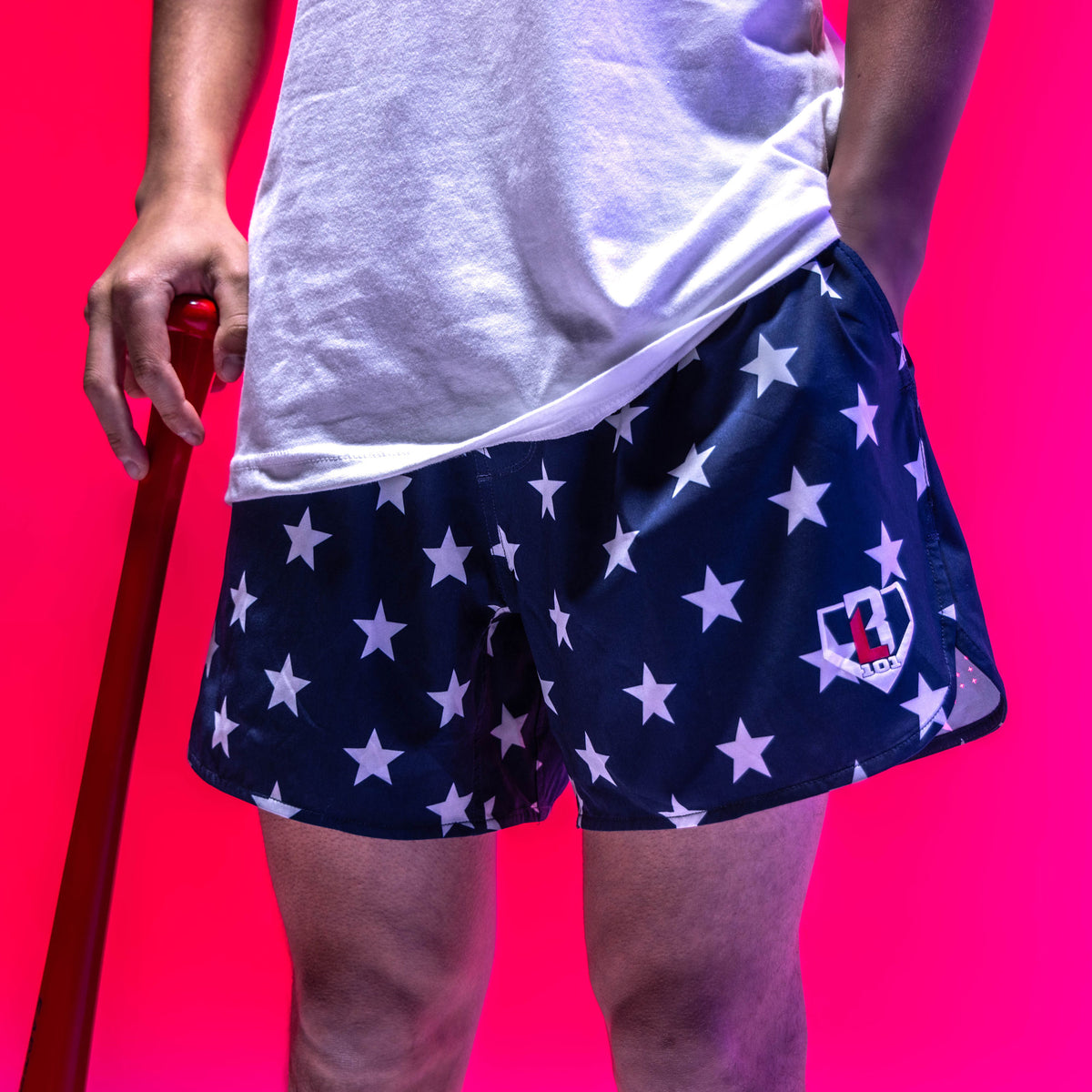 Youth model wearing navy Pro Series Freedom youth shorts