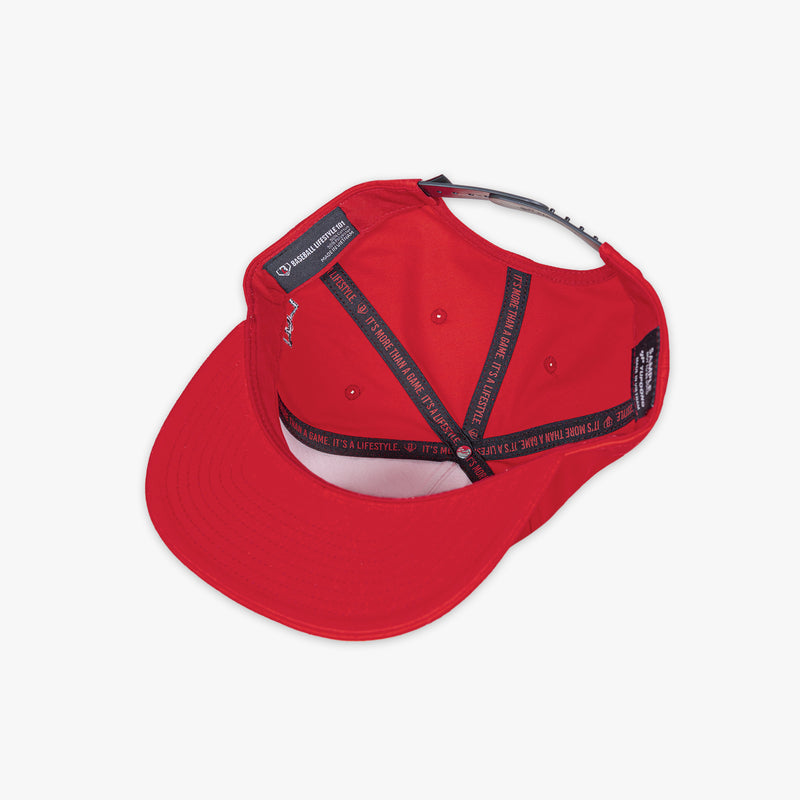 Adult model wearing red and black Filthy Off Field Snapback hat