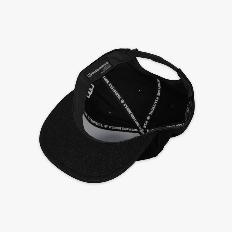 Adult model wearing black and white Filthy Off Field Snapback hat