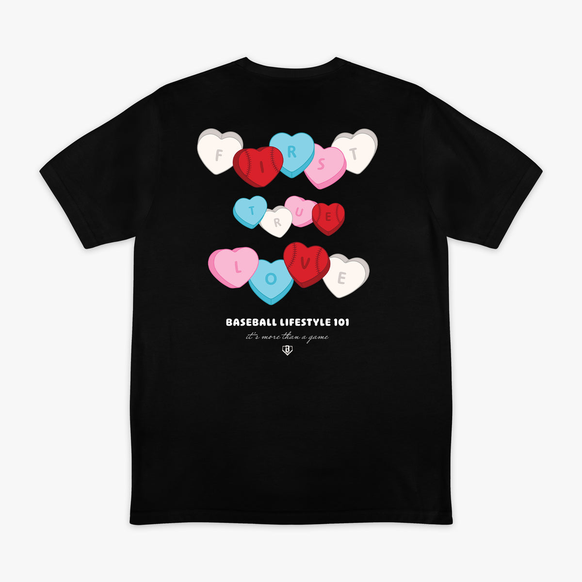 Black t-shirt with colorful heart designs and 'First True Love Baseball Lifestyle 101' text on a white background