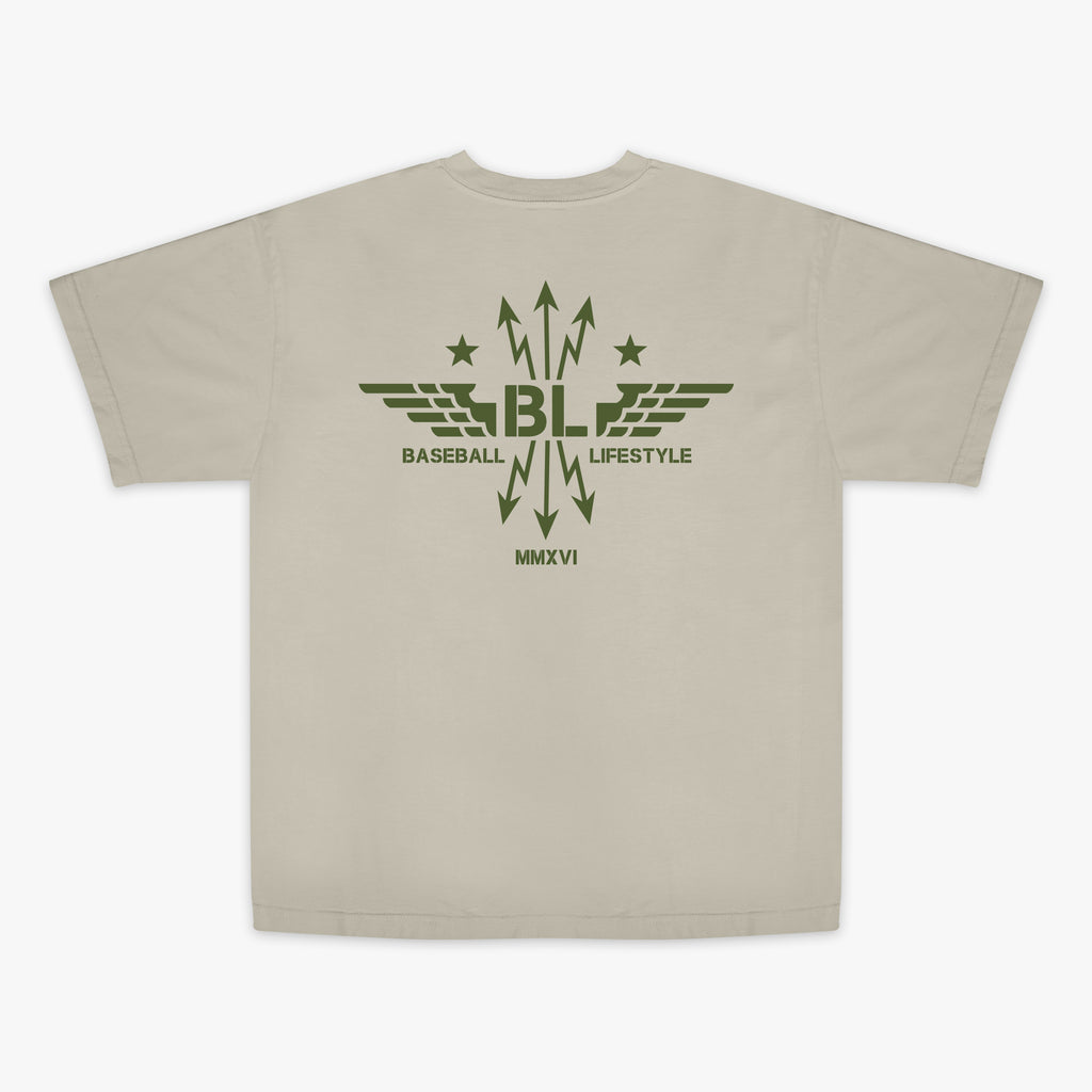 Tan t-shirt with dark green graphic featuring wings, arrows, and stars, with the Baseball Lifestyle BL logo in the center