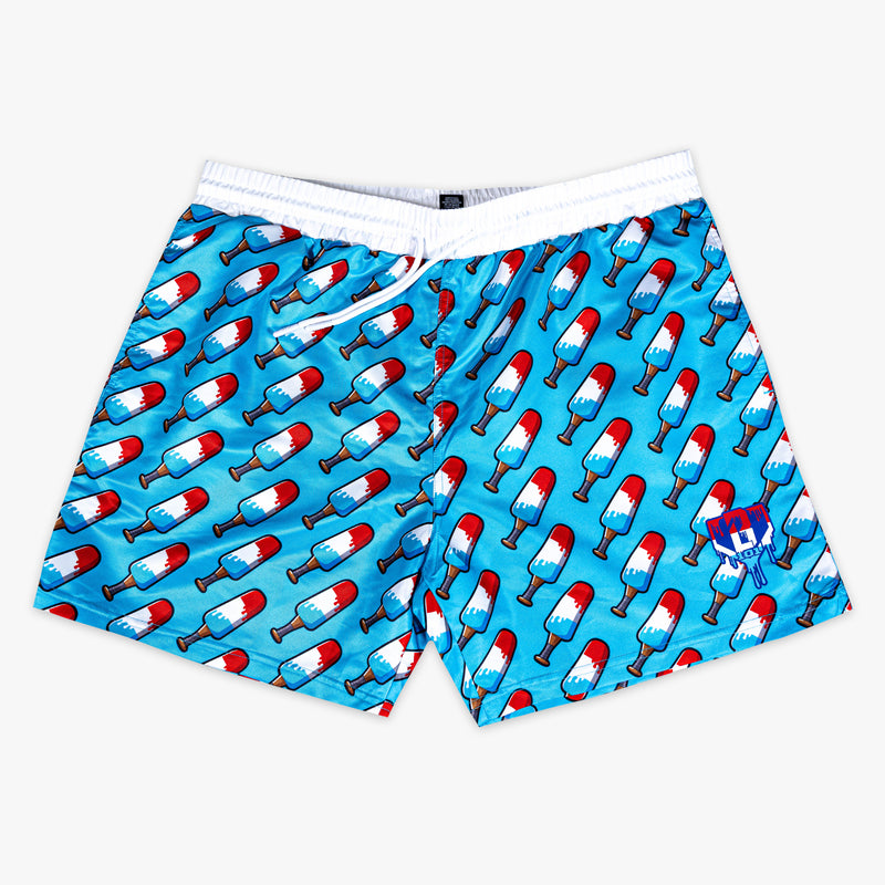 Blue shorts with red,  blue and white popsicle print on a white background