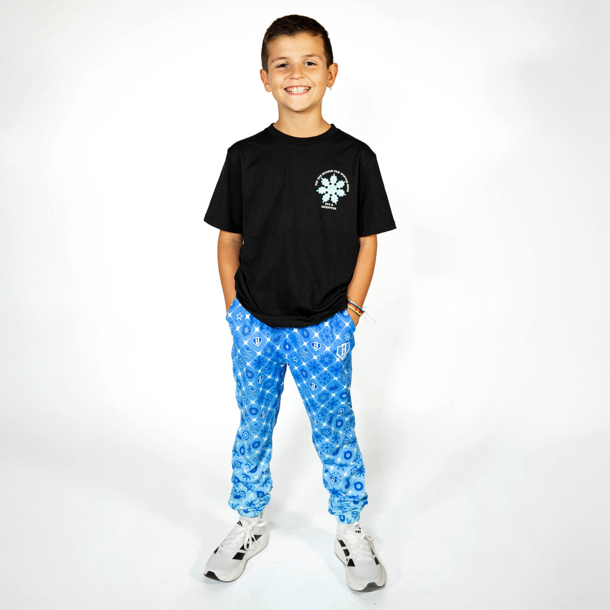 Youth model wearing black youth graphic tee with "Frozen Diamond" design