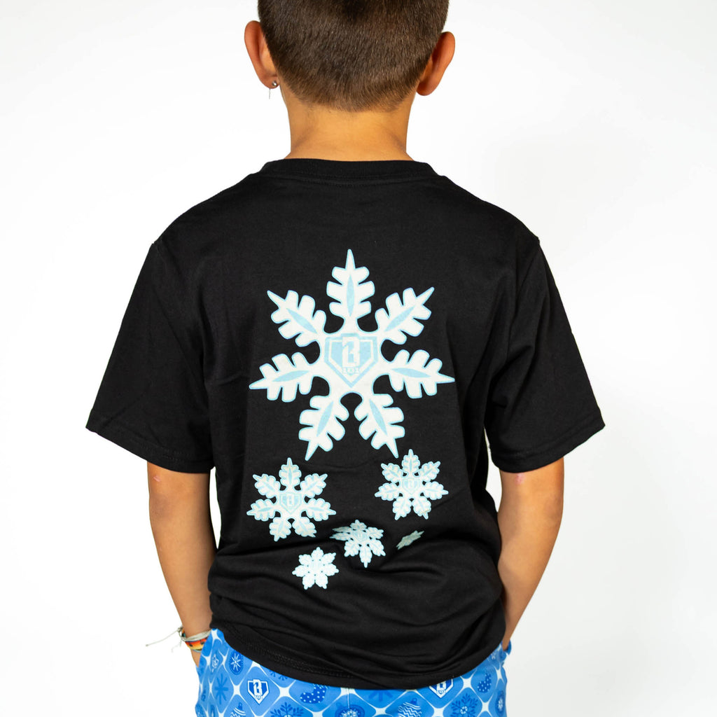 Youth model wearing black youth graphic tee with "Frozen Diamond" design