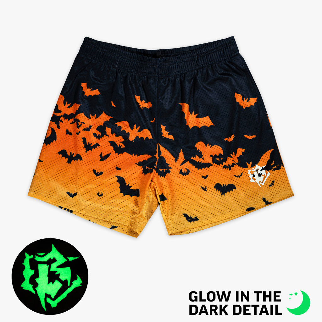 Orange shorts with glow-in-the-dark "Bat Gradient" detail