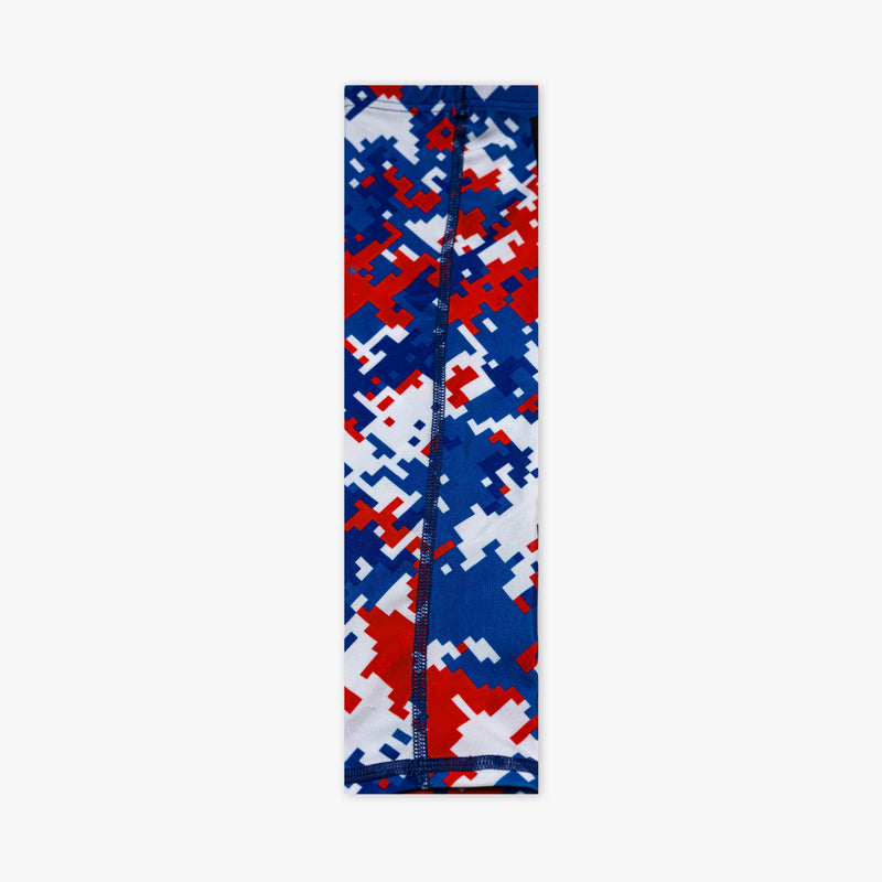 Red white and blue digital camo arm sleeve laid flat showing back seam with navy stitching on white background