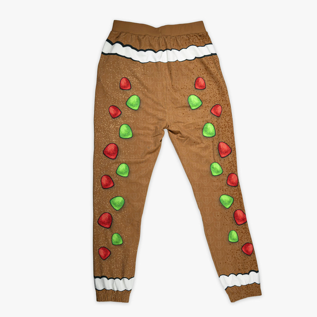 Brown youth pajama pants with "Gingerbread Rookie" design — back view