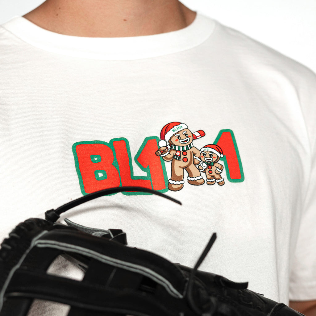 Adult model wearing white graphic tee with "Gingerbread Rookie" design