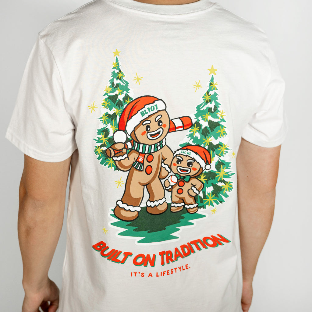 Adult model wearing white graphic tee with "Gingerbread Rookie" design