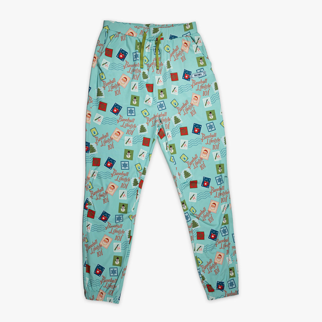 Teal youth pajama pants with "Holiday Stamps" design — front view