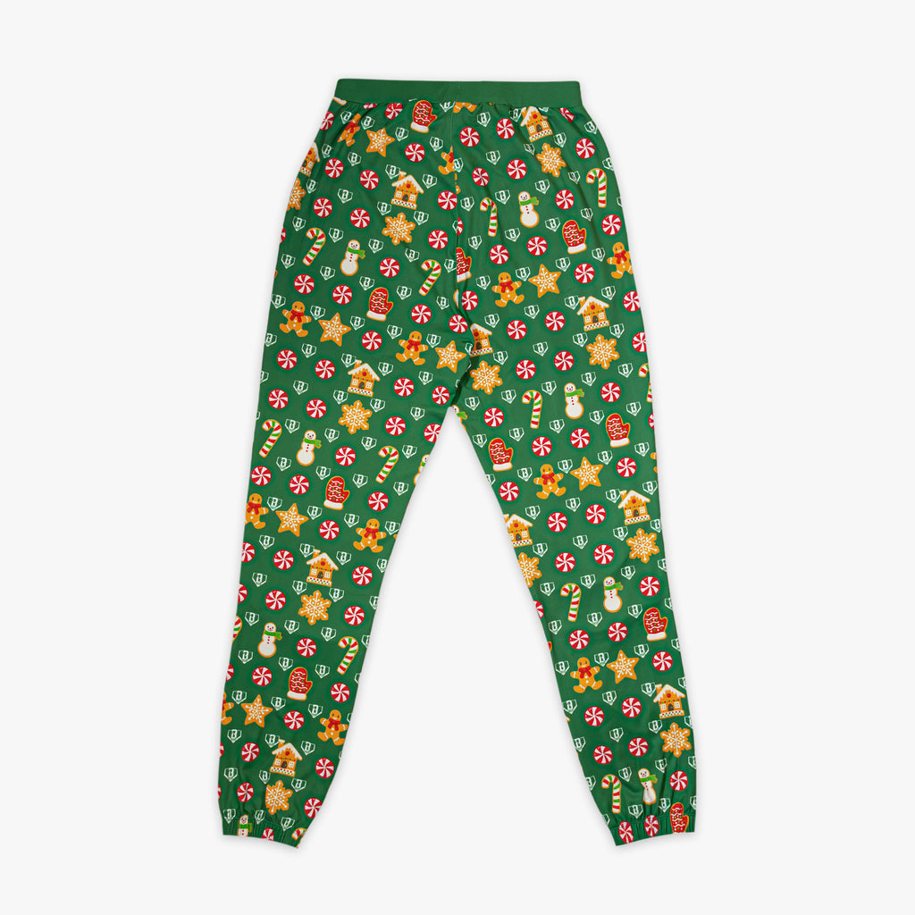 Green pajama pants with festive Christmas pattern on a white background
