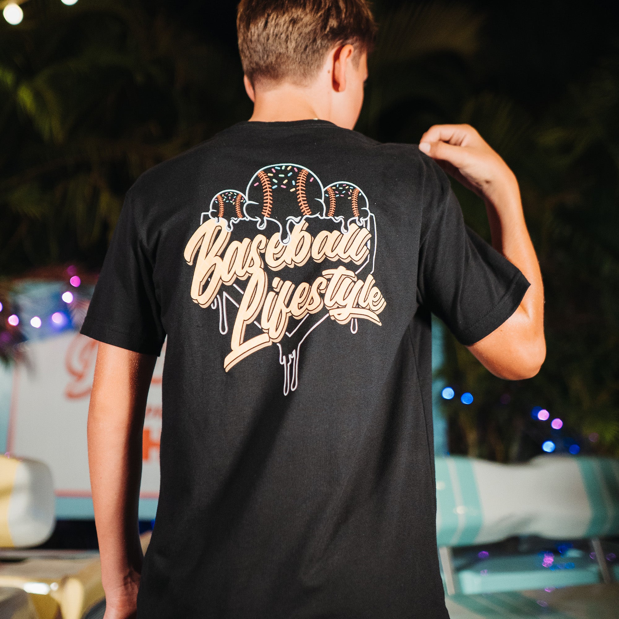 Adult model wearing black Ice Cream Midnight Sundae graphic tee