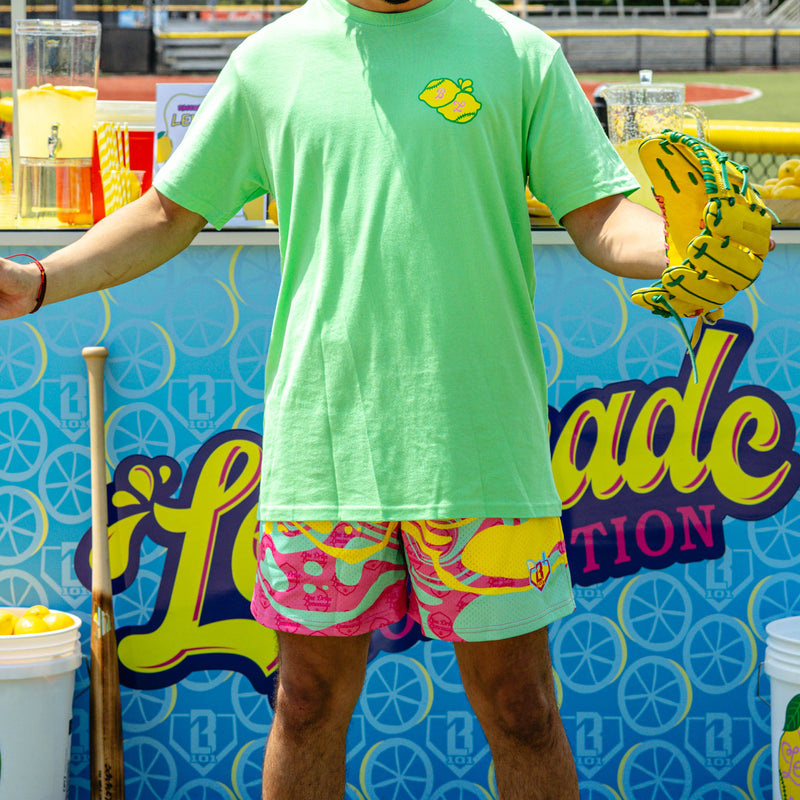 Adult model wearing multi-color shorts with "Lemon Burst" design