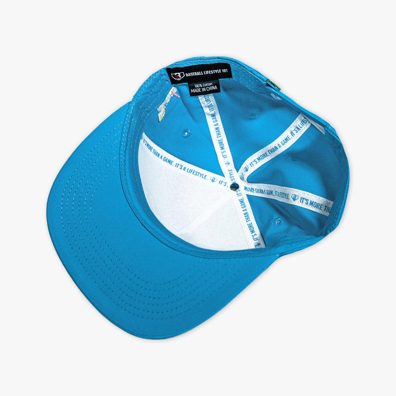 Adult model wearing blue hat with "Lemonade Off Field" design