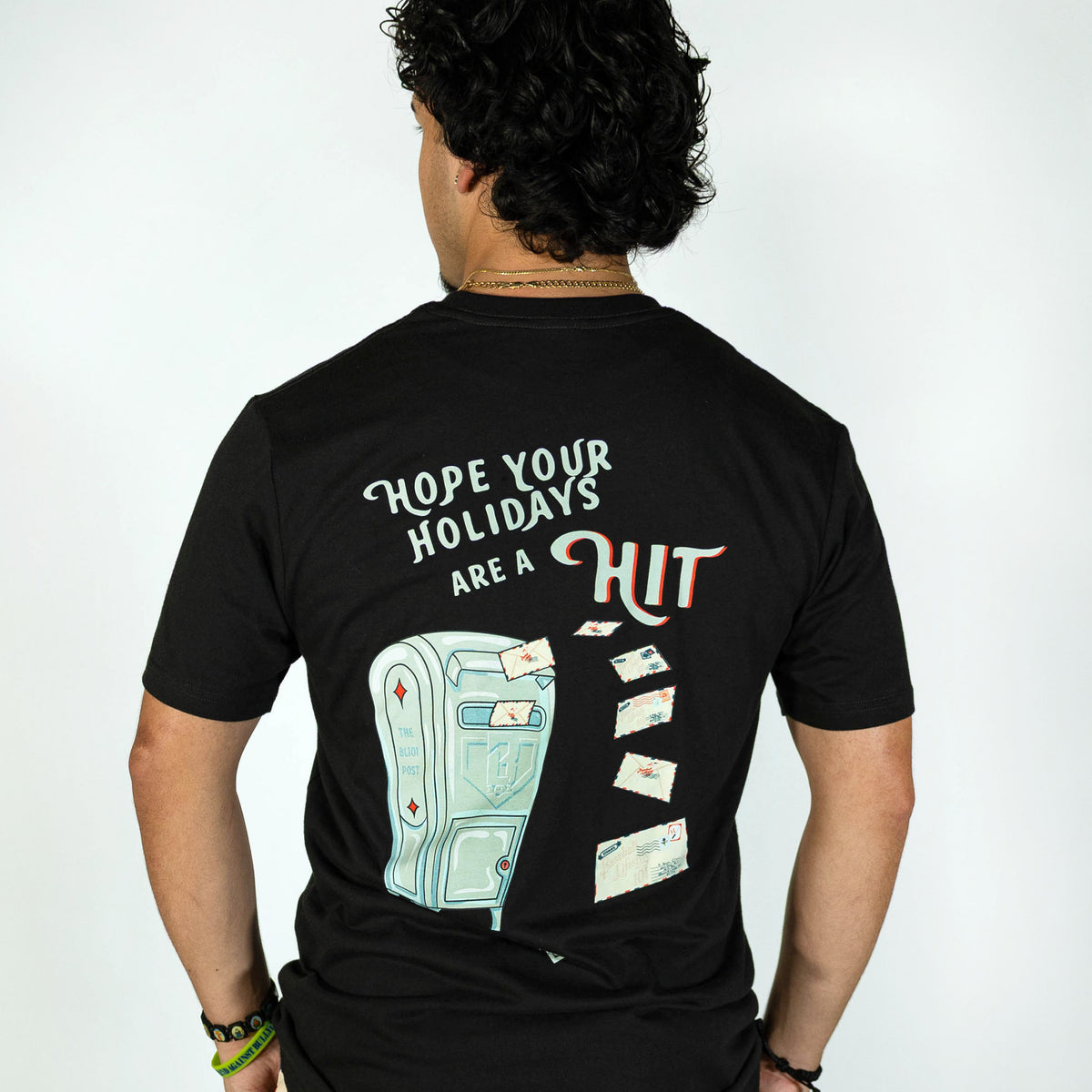 Adult model wearing black graphic tee with "Letter To Santa" design