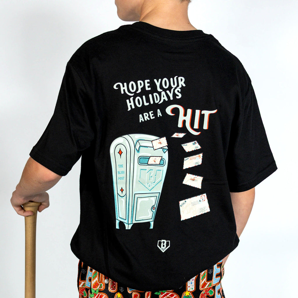 Youth model wearing black youth graphic tee with "Letter To Santa" design