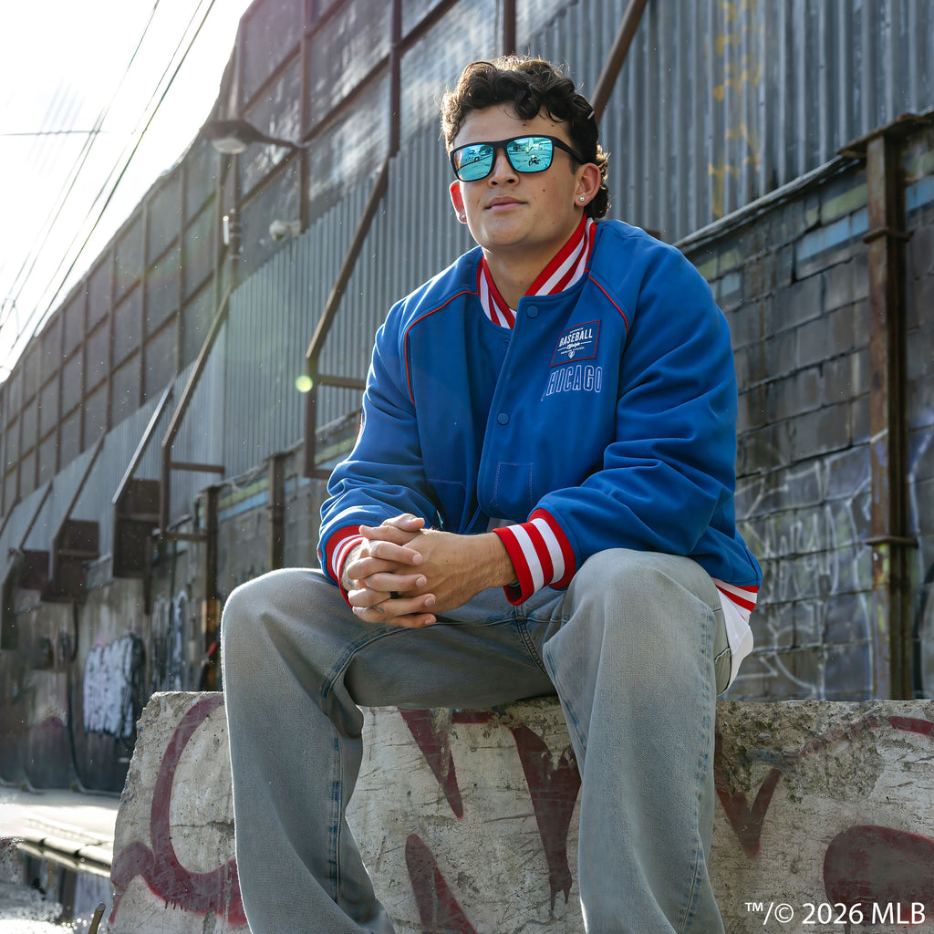 Adult model wearing blue Chicago Cubs Stadium bomber jacket