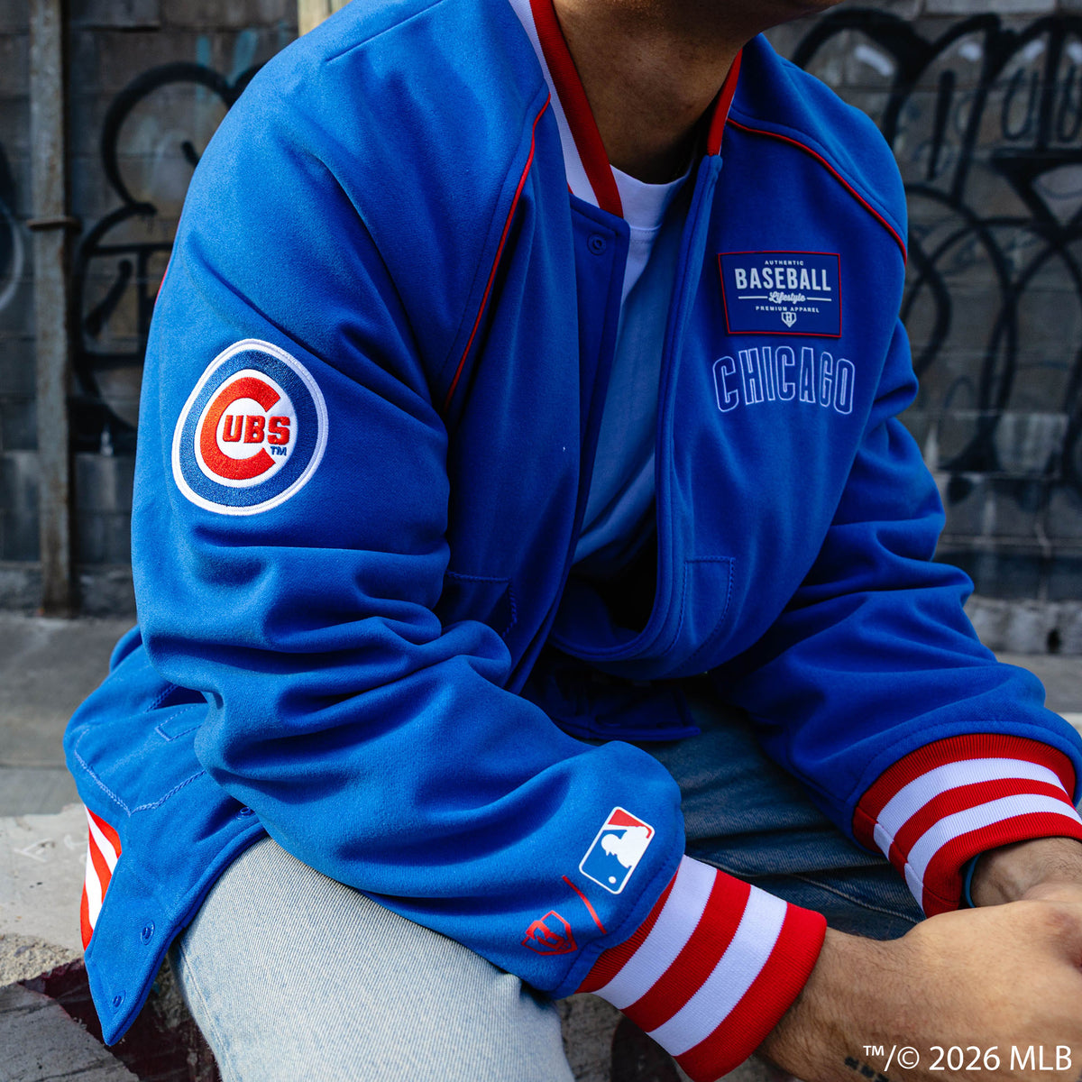 Adult model wearing blue Chicago Cubs Stadium bomber jacket