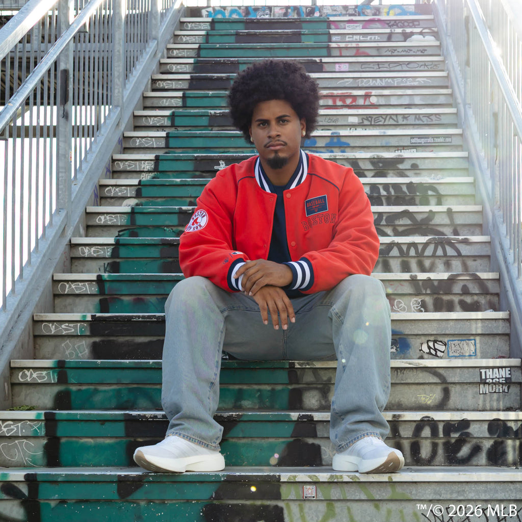 Adult model wearing red Boston Red Sox Stadium bomber jacket