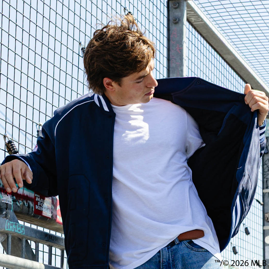 Adult model wearing navy New York Yankees Stadium bomber jacket