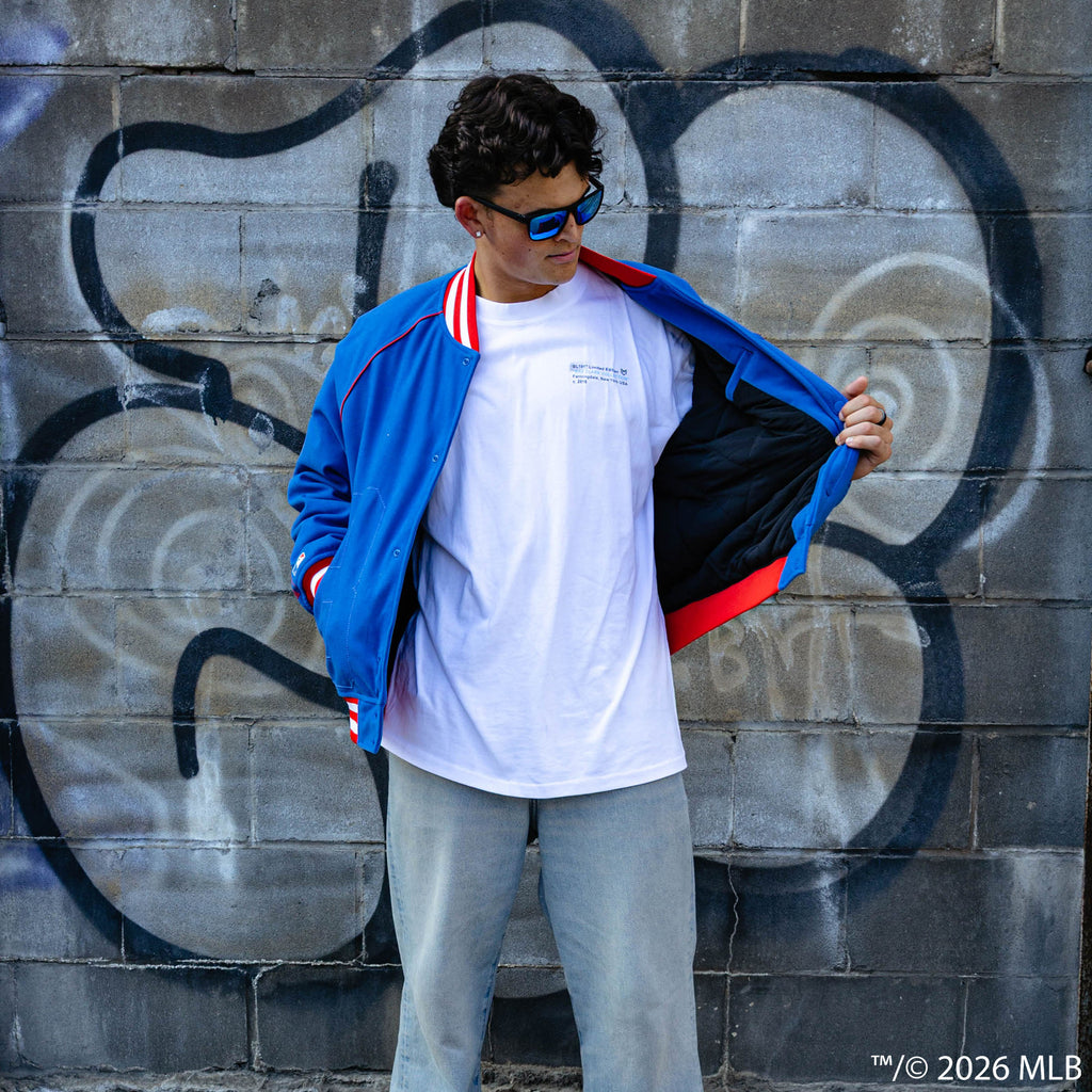 Adult model wearing blue Chicago Cubs Stadium bomber jacket