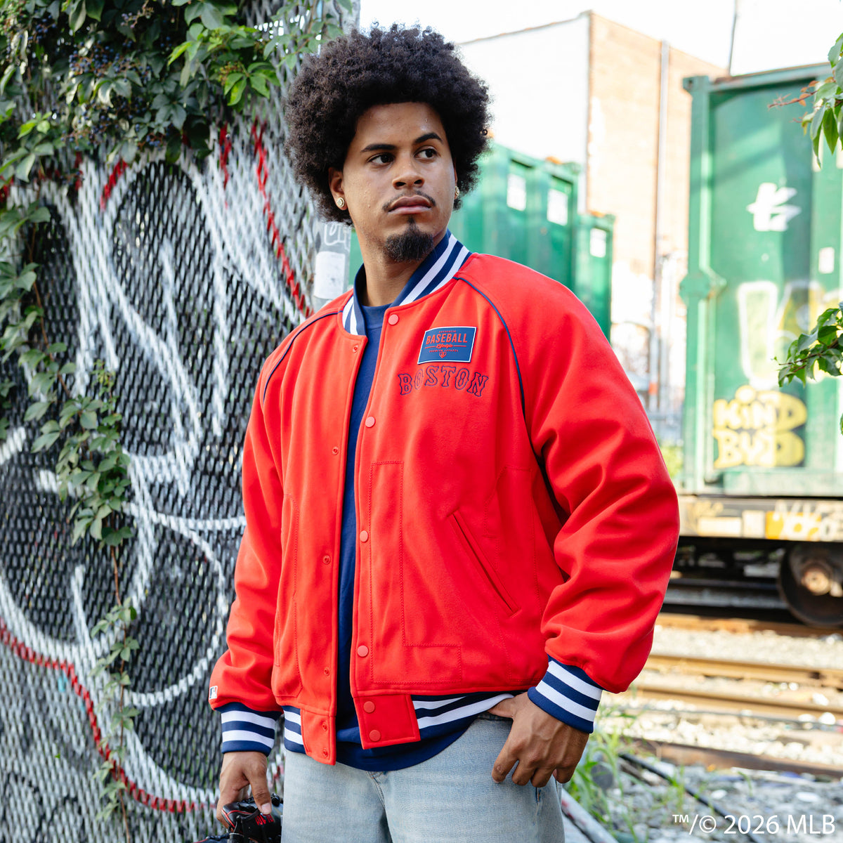 Adult model wearing red Boston Red Sox Stadium bomber jacket