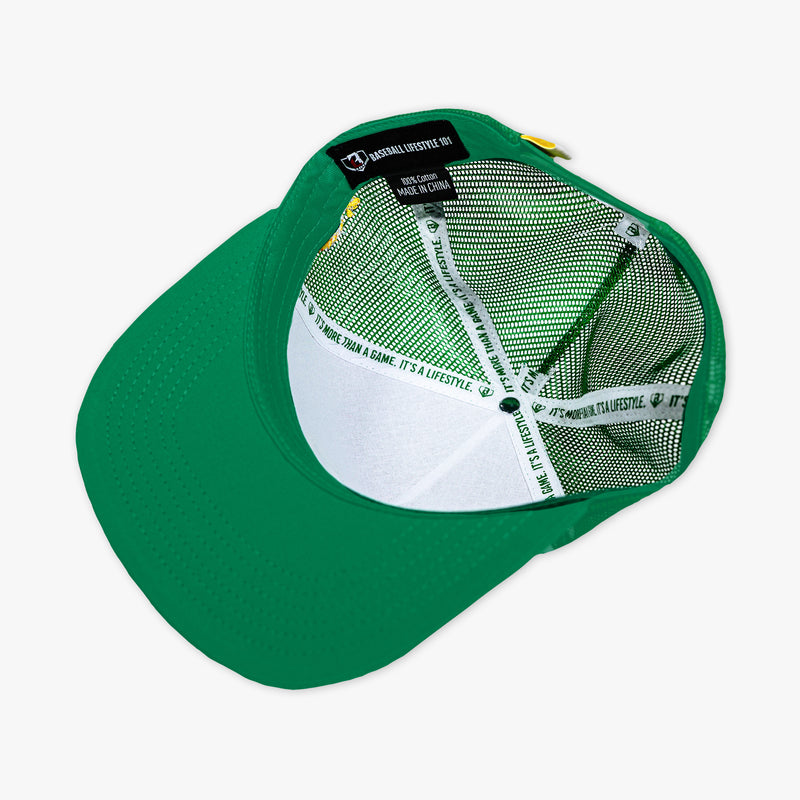 Adult model wearing green hat with "Line Drive Off Field" design