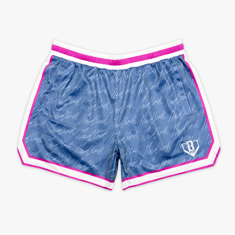 Youth model wearing youth shorts with "Max Clark Signature" design