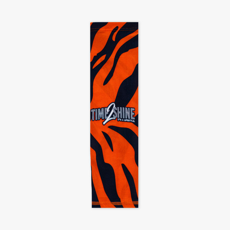 Orange and black zebra-striped towel with 'Time Shine' logo on a white background