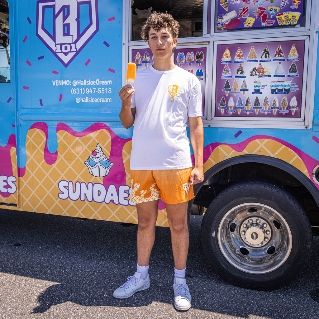 Adult model wearing white Ice Cream Creamsicle graphic tee