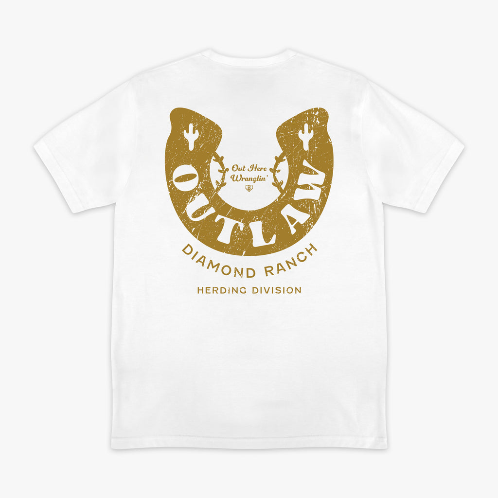 White t-shirt with gold horseshoe design and 'Outlaw Diamond Ranch' text on a white background