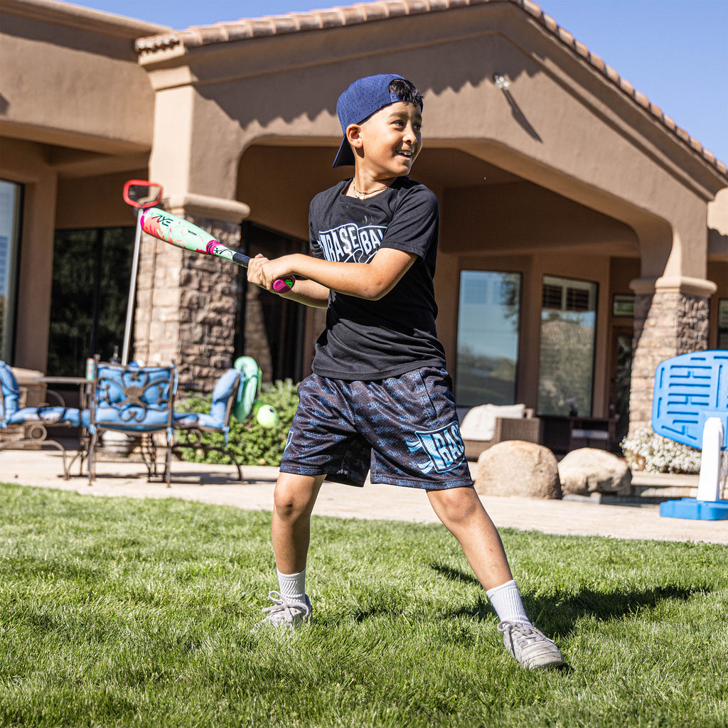 Youth model wearing black and light blue Pennant youth shorts