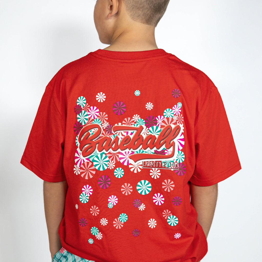 Youth model wearing red youth graphic tee with "Peppermint Plaid" design