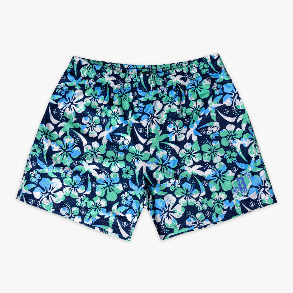 Navy blue shorts with a green, blue and white floral pattern on a white background