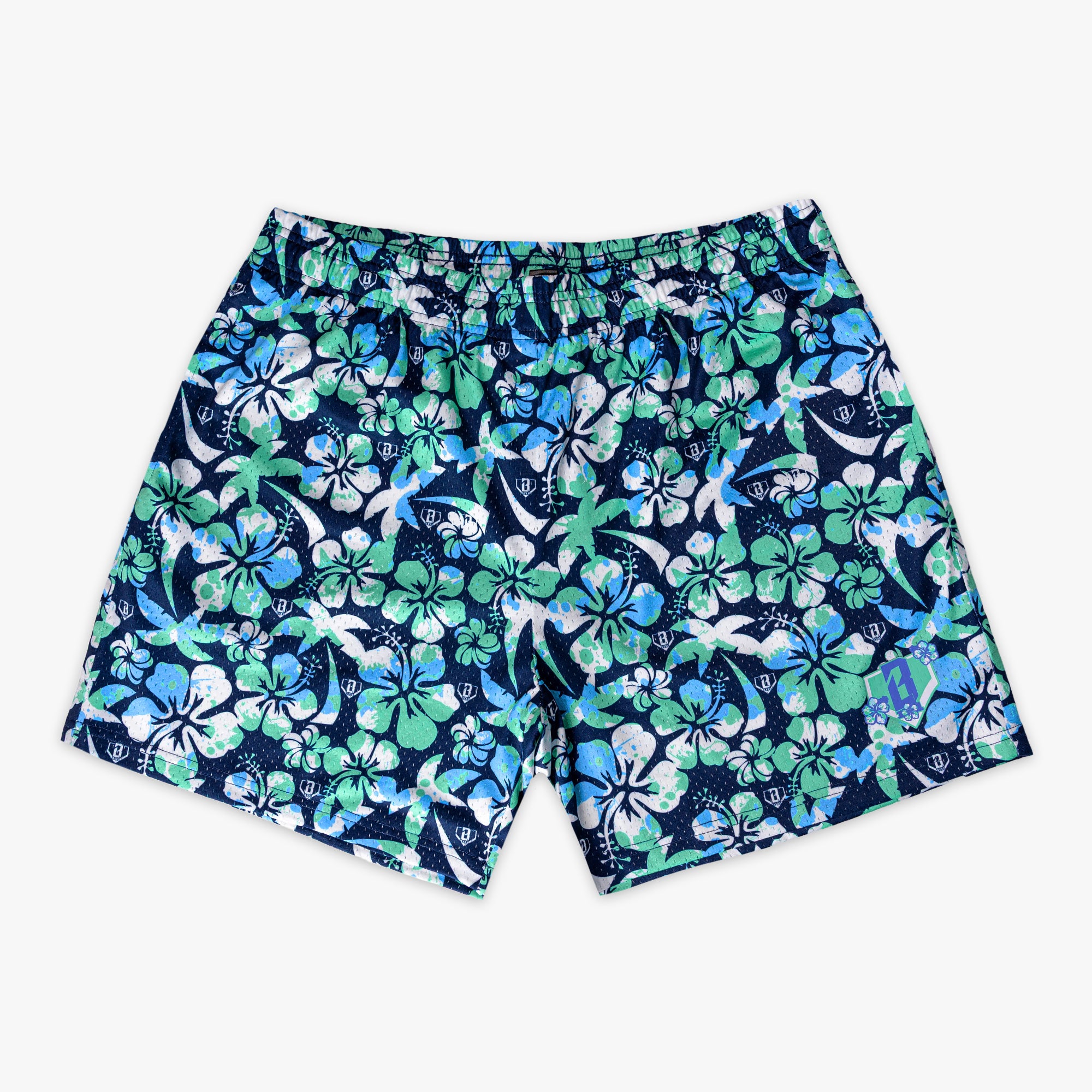 Navy blue shorts with a green, blue and white floral pattern on a white background