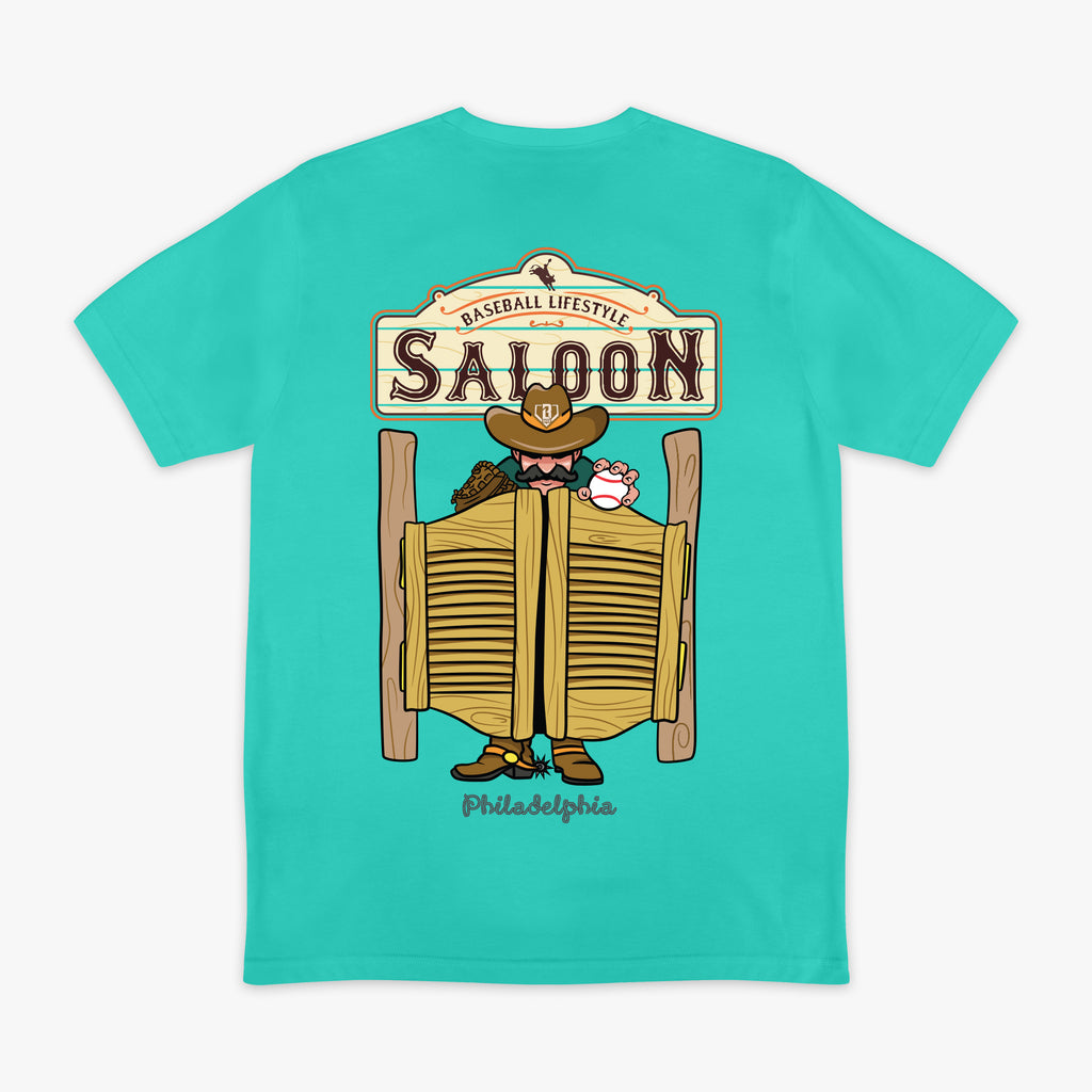 Teal t-shirt with a graphic of a saloon door and cowboy on the back, on a white background.