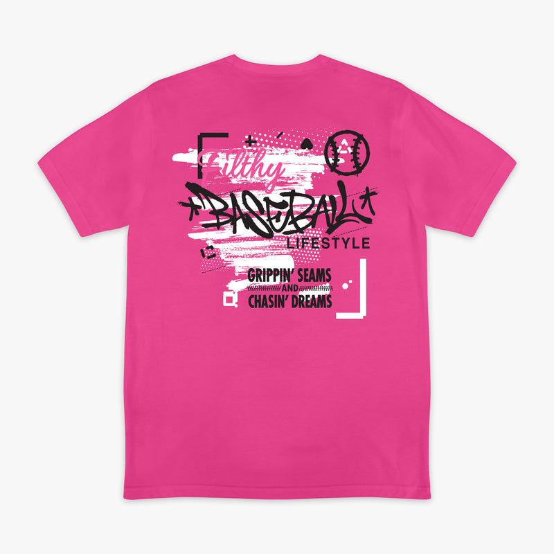 Pink t-shirt with black and white graffiti graphic design with 'Filthy Baseball Lifestyle Grippin Seams and Chasin Dreams' text