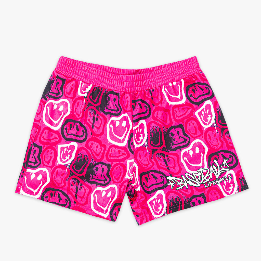 Pink shorts with black and white smiley graphics on a white background