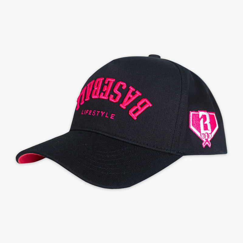 Black and pink Baseball Cap with pink upside down 'Baseball Lifestyle' text and white BL101 logo on side with breast cancer awareness symbol on it 