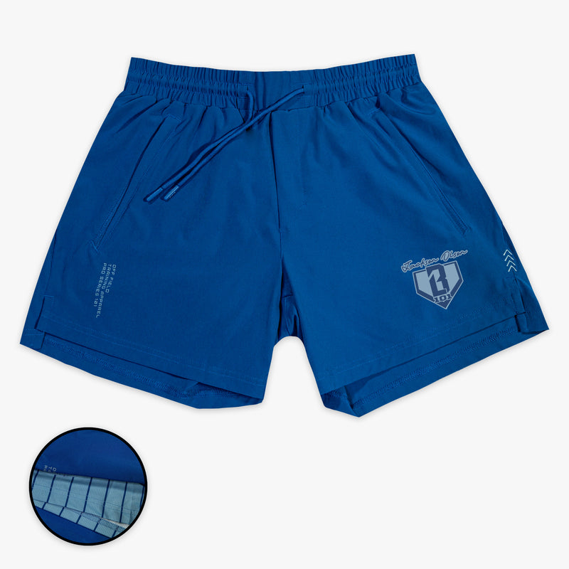 Blue shorts with a small BL101 Jackson Olson logo on a white background