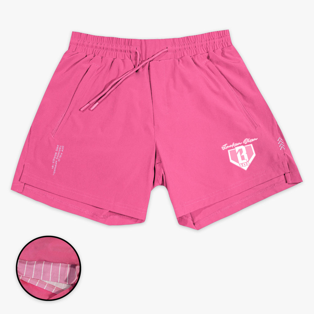 Pink shorts with a Jackson Olson BL101 logo on a white background