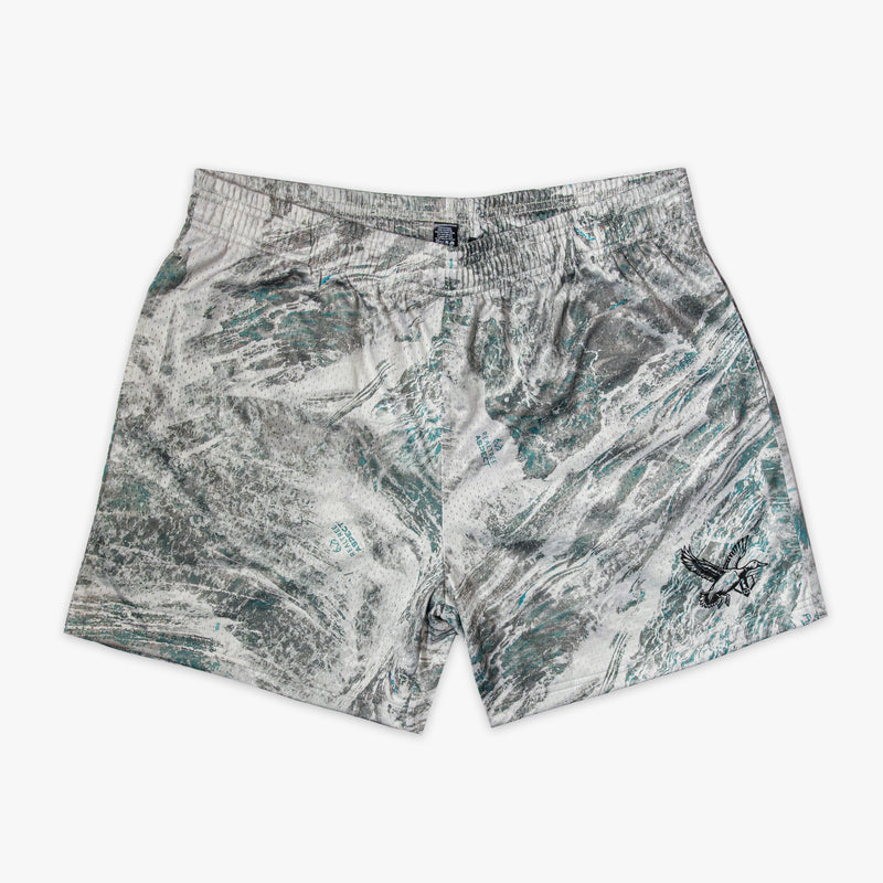 Marbled patterned shorts on a white background