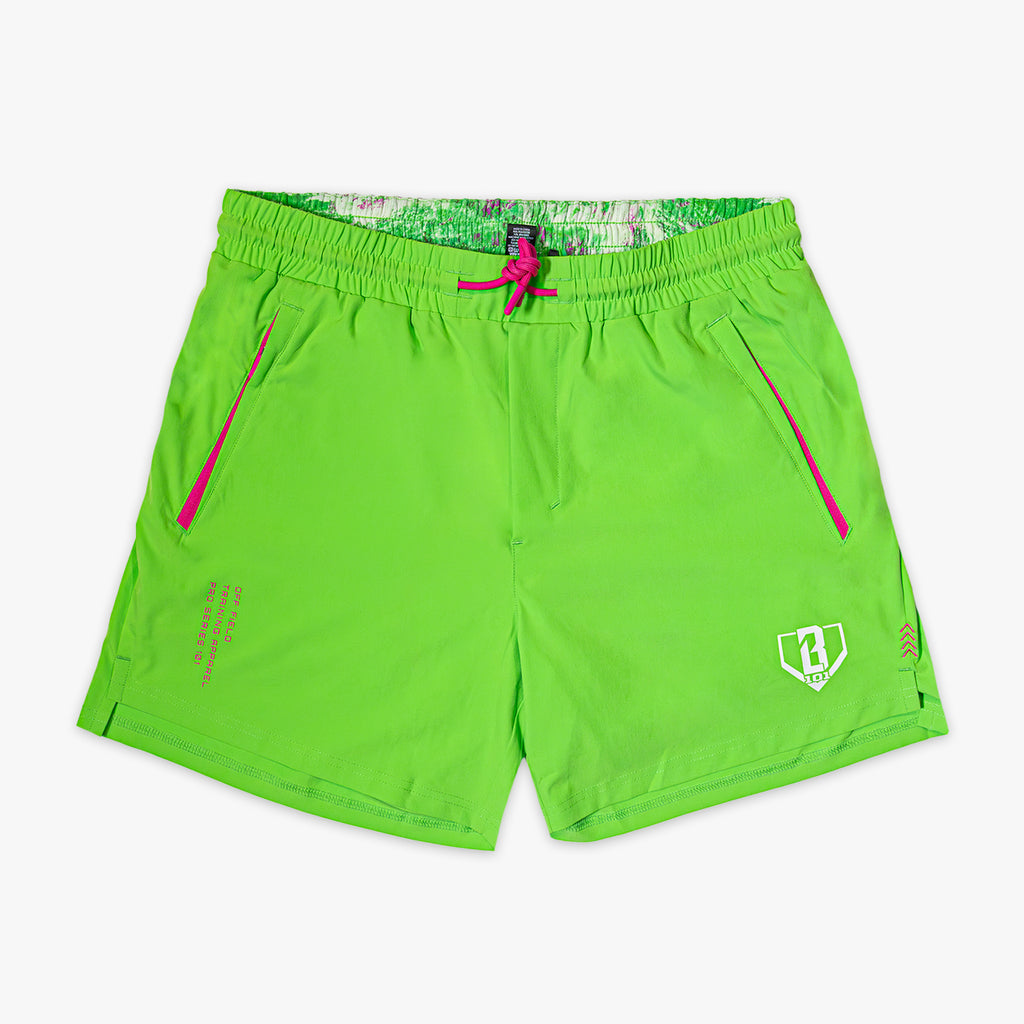 Green shorts with pink accents on a white background