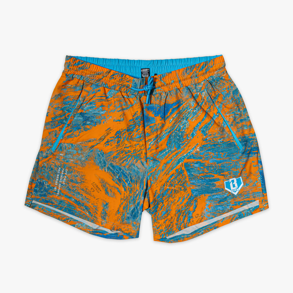 Orange and blue marble patterned shorts on a white background