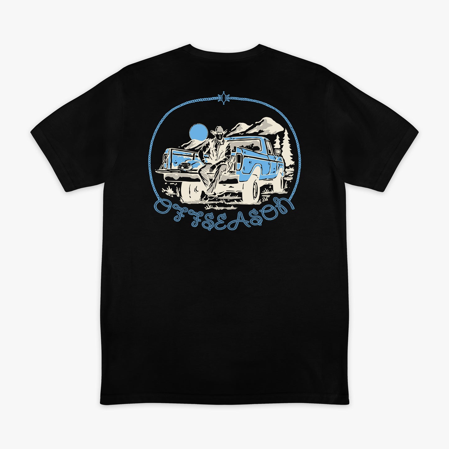 Black t-shirt with graphic design of a truck and mountains on a white background
