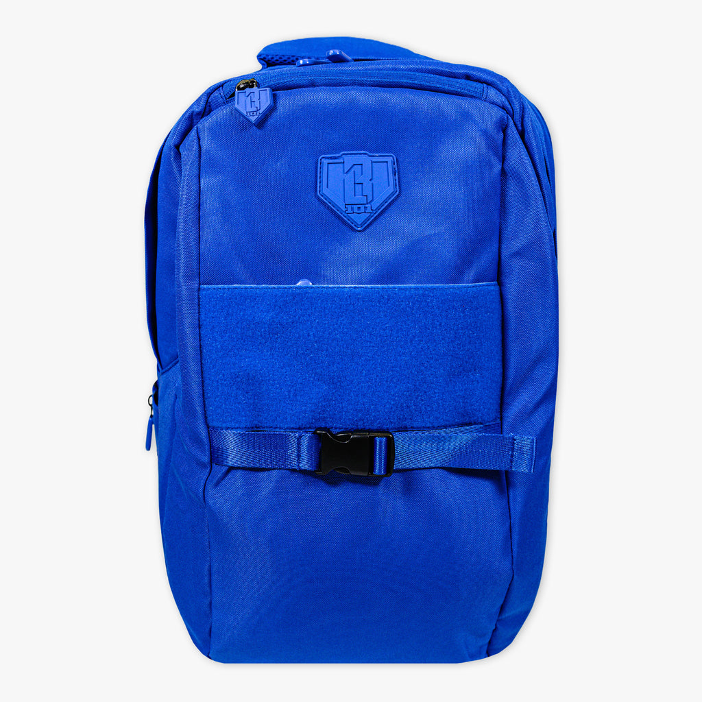 Adult model wearing blue backpack with "SZN 2" design