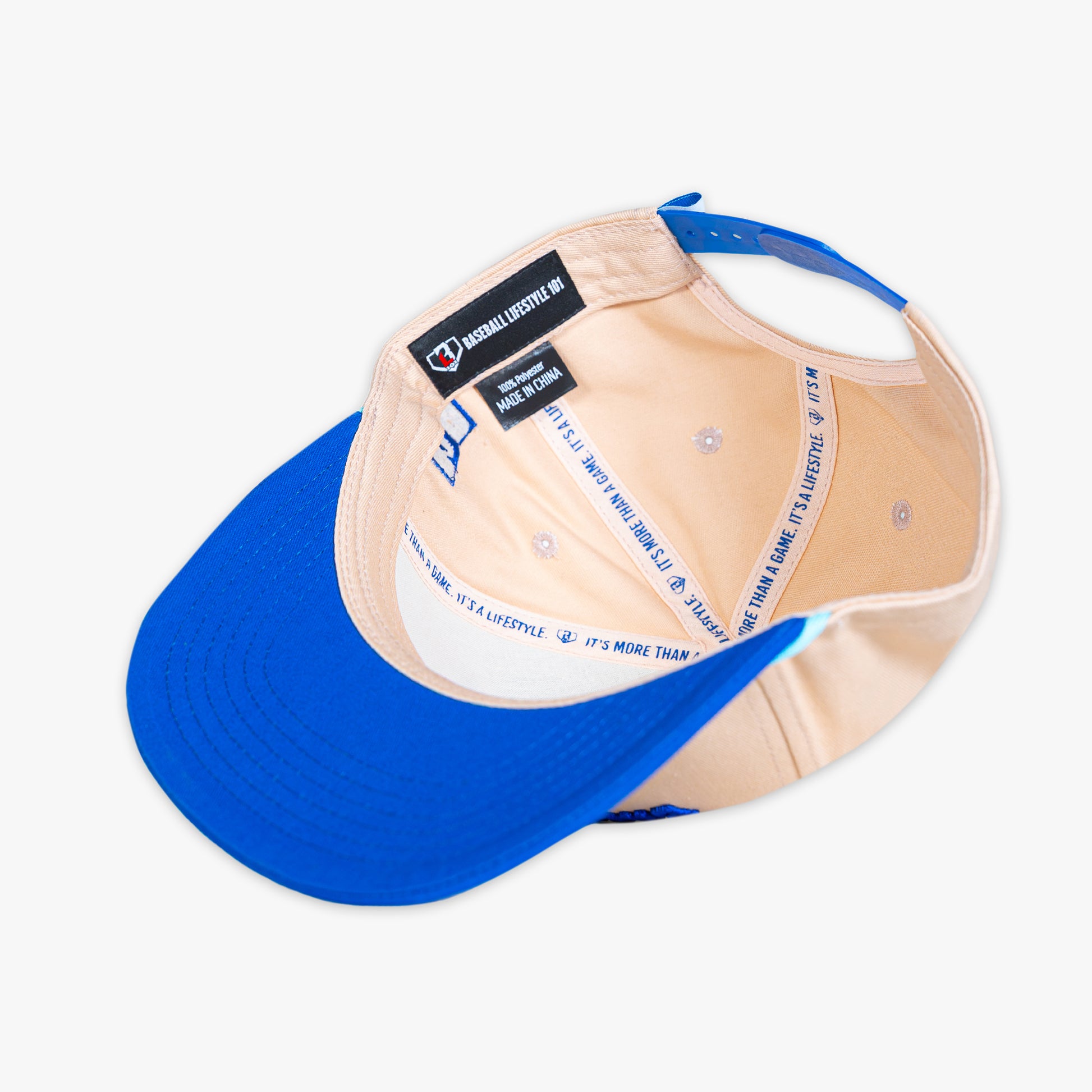 Blue and beige cap with Baseball Lifestyle Tag on a white background
