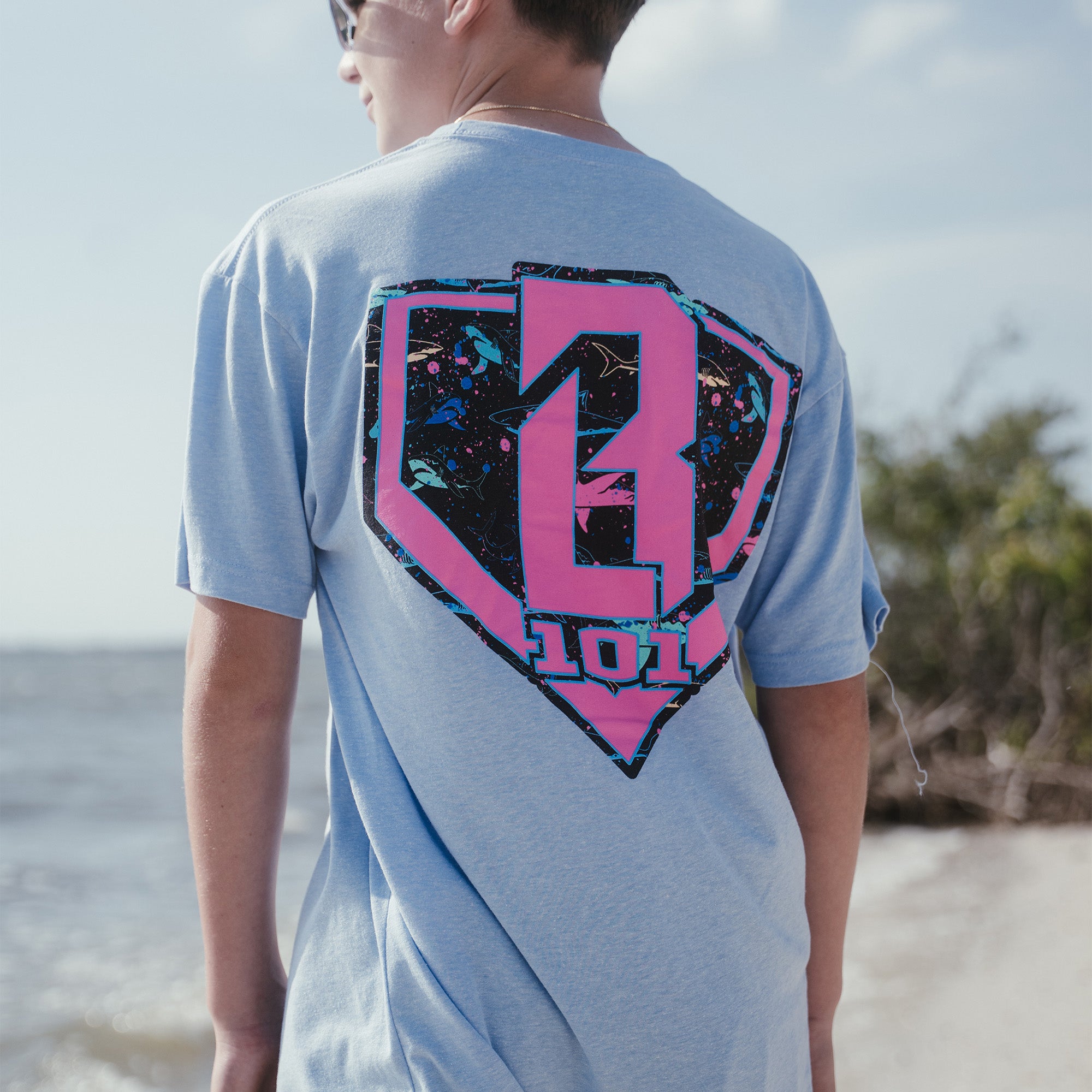 Youth model wearing blue Shark Cotton Candy Blue youth graphic tee