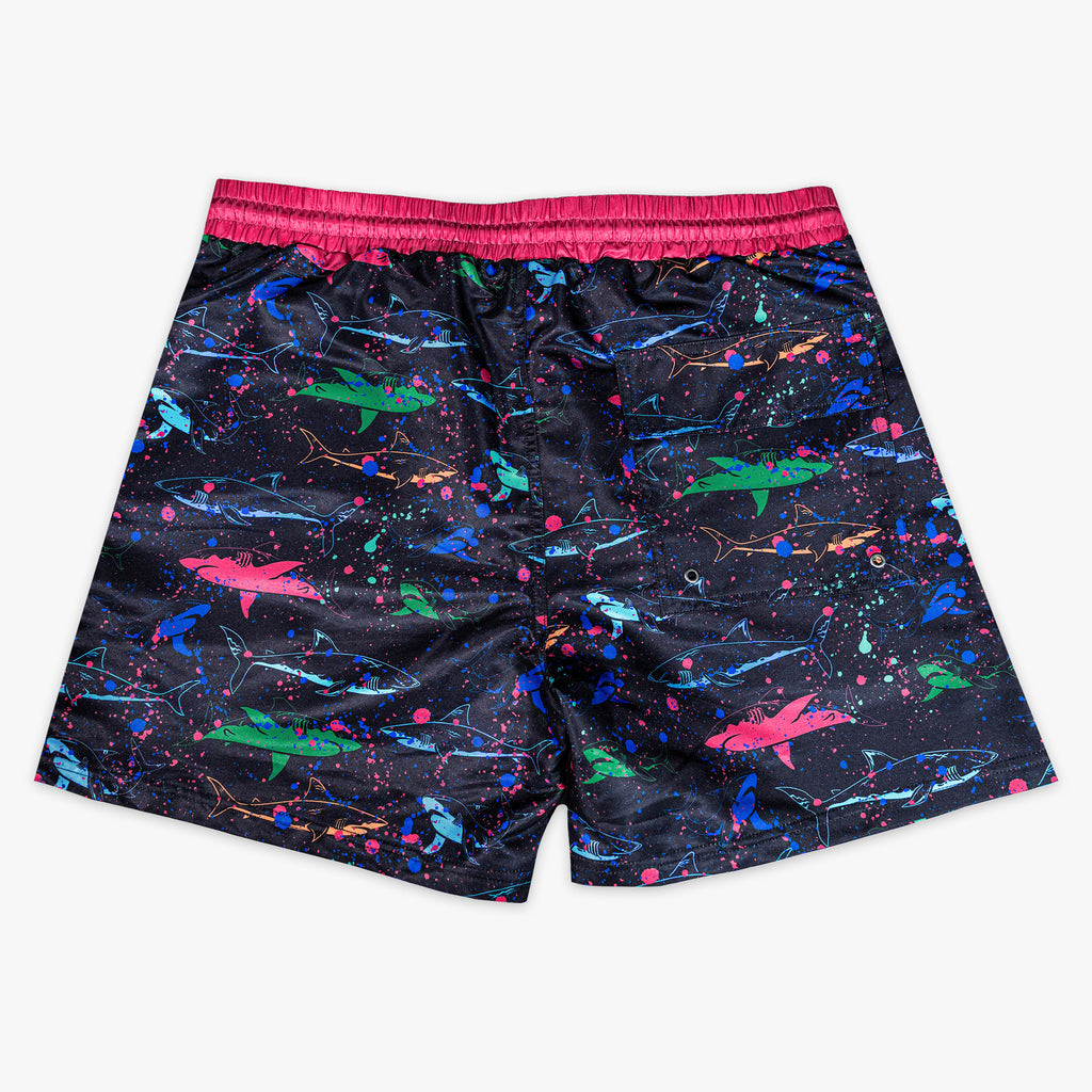 Rear view of BL101 black neon shark swim shorts on a white background, showing the back pocket with grommet drain.