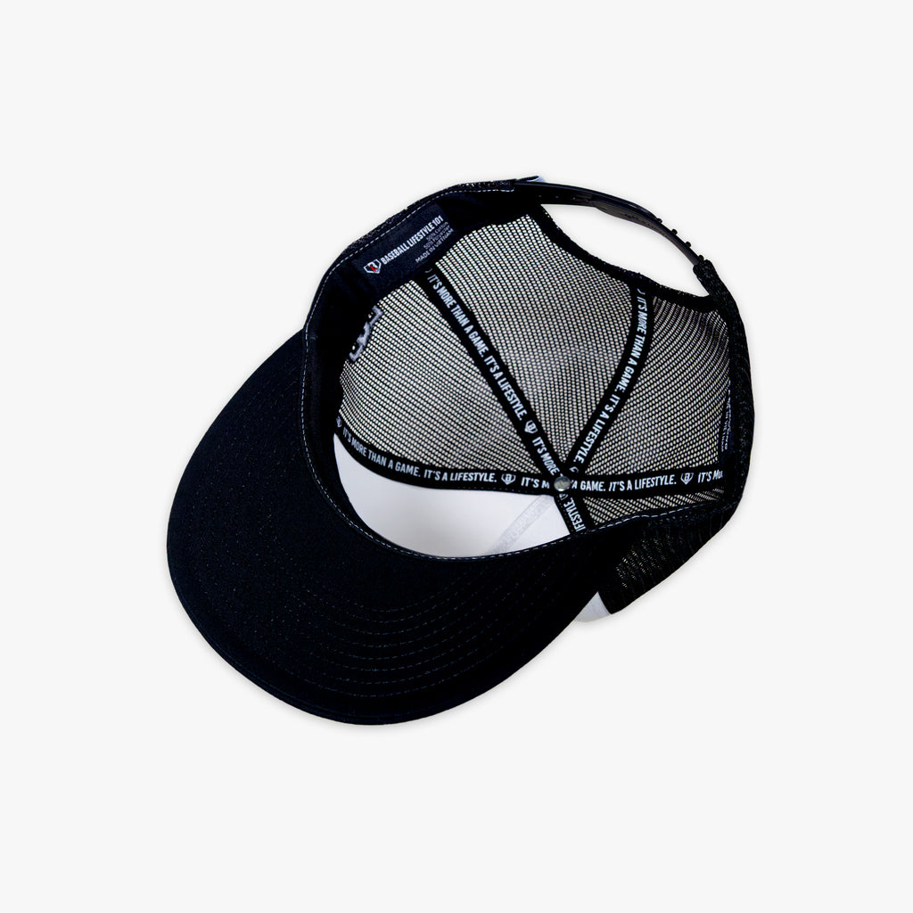 Black cap with white mesh back and Baseball Lifestyle tag on a white background